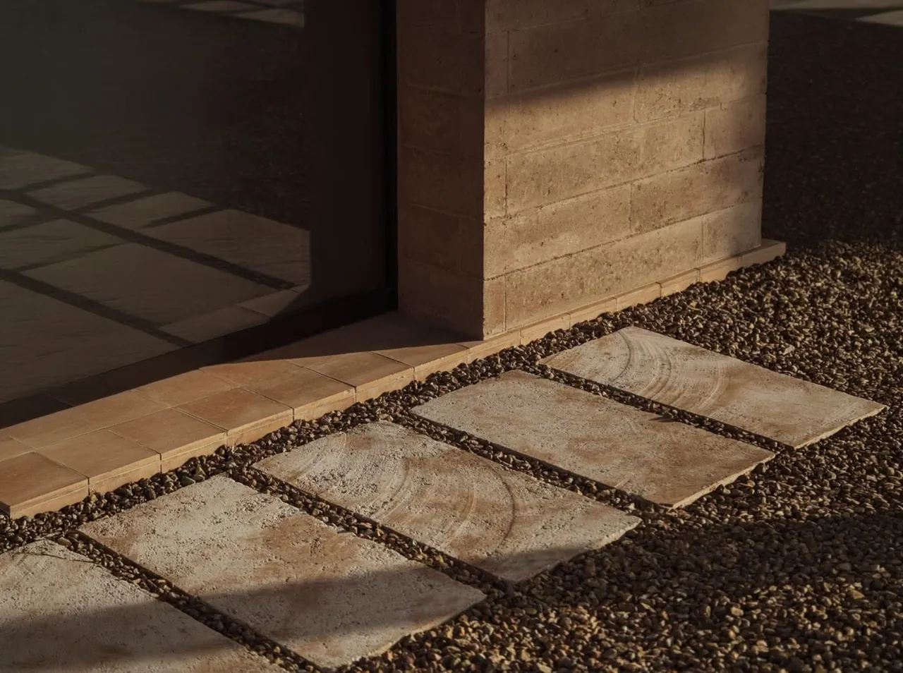 Outdoor paving and an architectural threshold