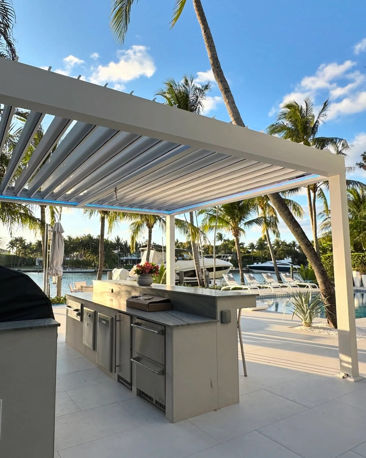 Open white pergola louvers above the Bal Harbour outdoor counter
